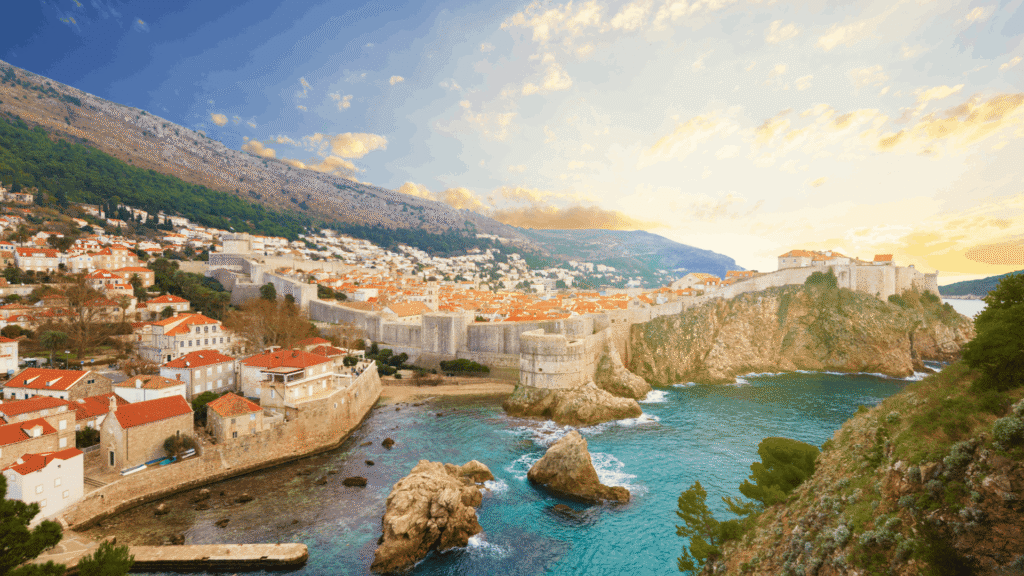 Dubrovnik Old Town walls, red-tiled rooftops and rocky Adriatic coastline in Croatia